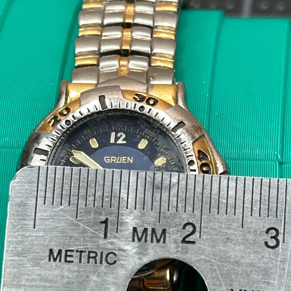 Gruen GR213 Two Tone Blue Dial Day Date Rotating Bezel Quartz‎ Watch